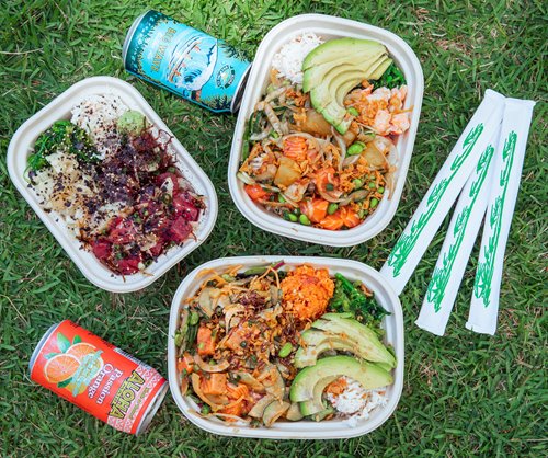 3 poke bowls with various toppings on the lawn with 2 beverage cans & 3 chopsticks.