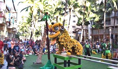 Chinese lion dance performance on the lawn at Waikiki Beach Walk