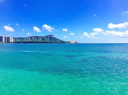 Ocean with Diamond Head in the background on a clear. sunny day.