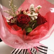 Pink & red wrapped rose bouquet available at Taormina Sicilian Cuisine in Waikiki for Mother's Day