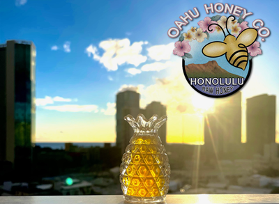 Pineapple-shaped glass jar filled with Hawaiian honey.