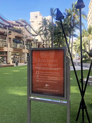 Social distancing signage at Waikiki Beach Walkl