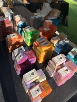 Assortment of colorful soaps on a table at the Waikiki Beach Walk farmers market.