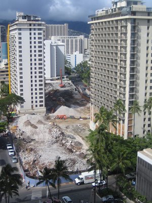 Piles of sand between buildings in Waikiki