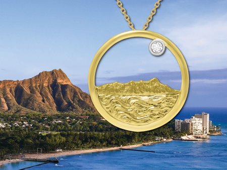 All-gold pendent cast in the shape of Diamond Head with a single round diamond in front of the real Diamond Head for comparison.