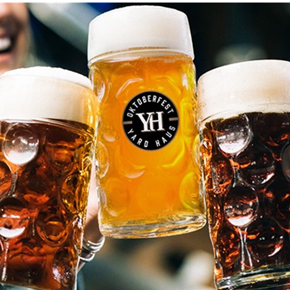 3 beer steins with the middle one saying Oktoberfest Yard House