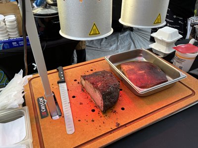 Sliced slab of juicy prime rib on a cutting board