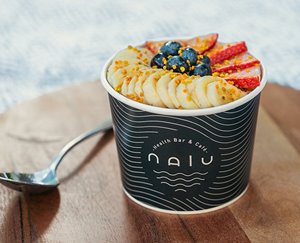 an acai bowl with fruit and berries