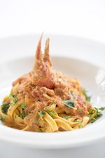 Granchio pasta with crab claw on top