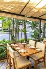 Outdoor terrace dining table at Taormina in Waikiki