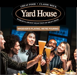 Group of people each holding a yard of beer