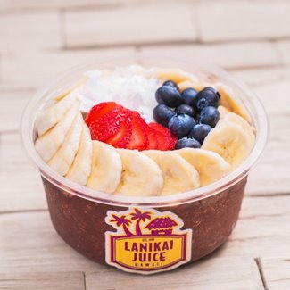 Acai bowl topped with bananas, strawberries, & blueberries from Lanikai Juice in Waikiki